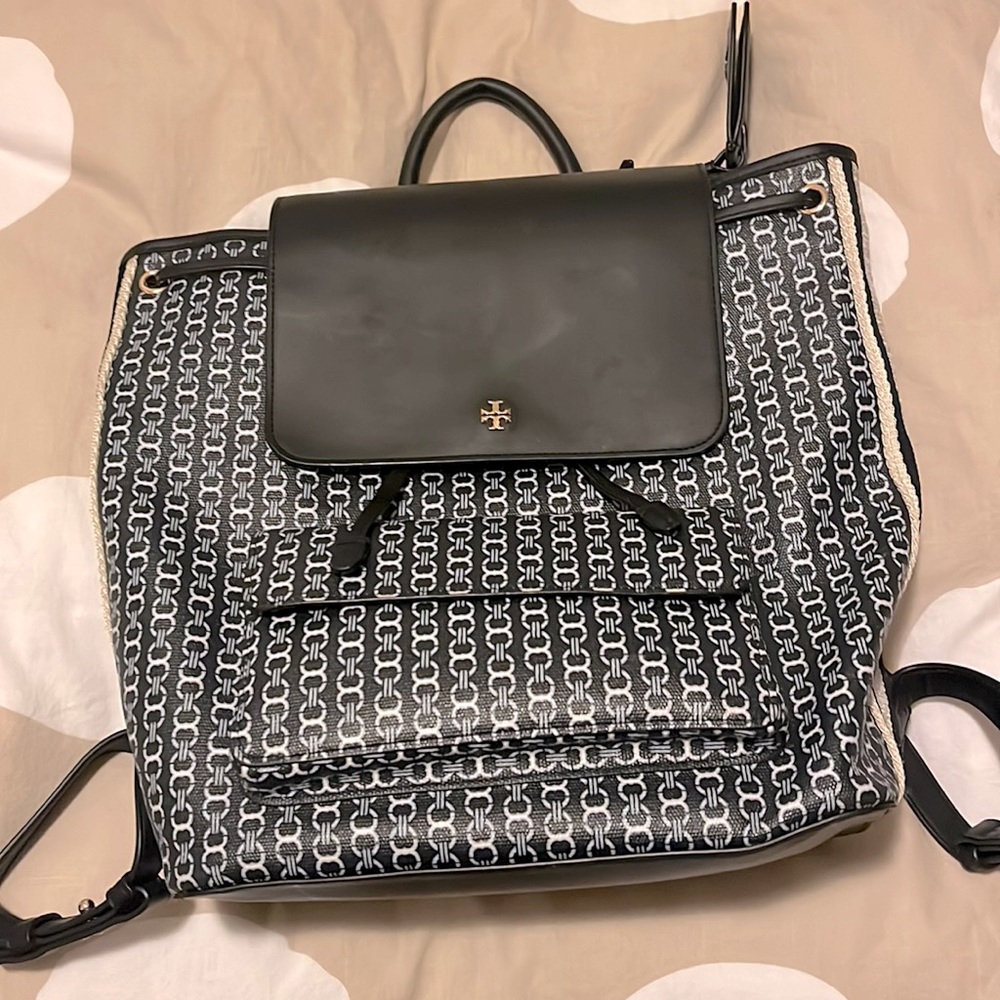 Tory Burch book bag. Very durable. I wore it to hold my books in school.